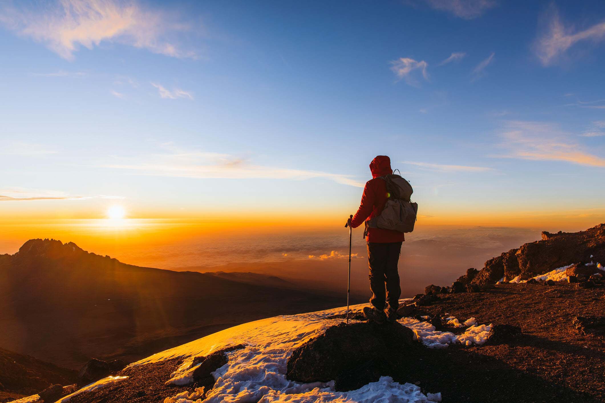 hiker on top of mt kilimanjaro