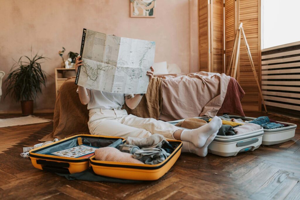 What to Pack for Zanzibar: Your Ultimate Packing Checklist 2 reading a map while packing